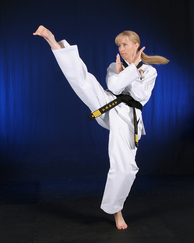 Mrs. Lyn Cerminaro demonstrating a head high twist kick